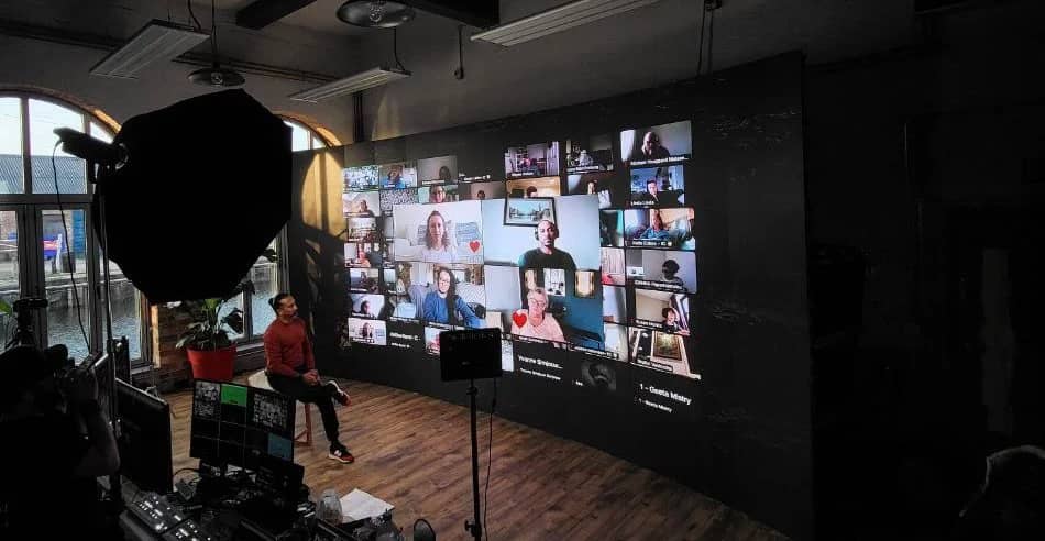 Dylan Ayaloo leading a virtual AWAKEN retreat with participants on screen